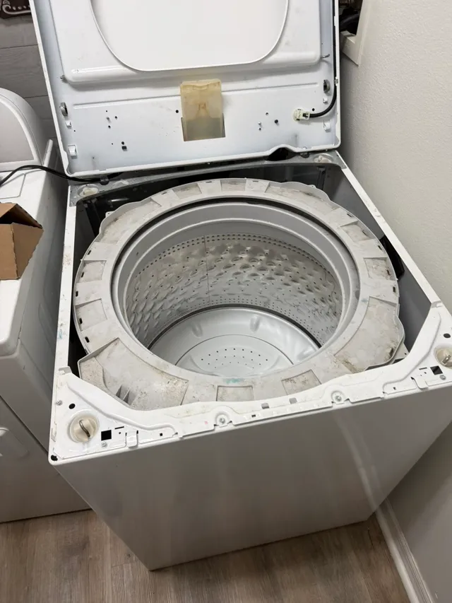 Top-load washer opened for repair
